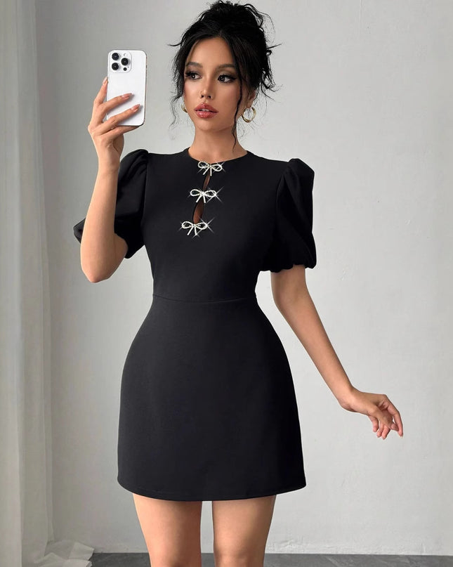 Europäische und amerikanische Damen Kleid mit Rundhalsausschnitt, hohlen Kristall-Puffärmeln und taillierter Passform
